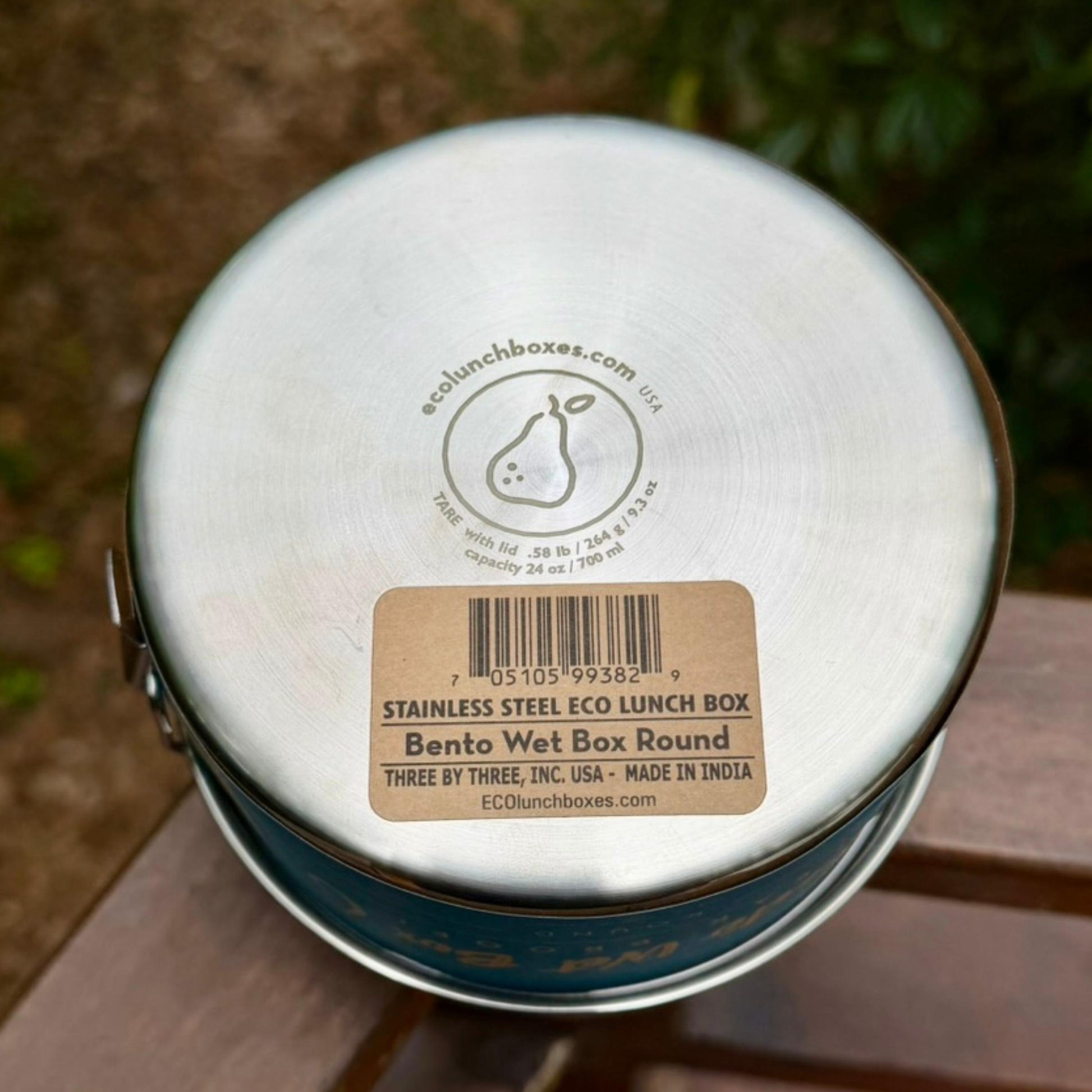 Bottom view of ECOlunchbox Bento Wet Box Round showing engraved tare weight, capacity, and UPC barcode sticker.