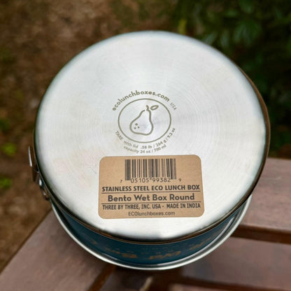 Bottom view of ECOlunchbox Bento Wet Box Round showing engraved tare weight, capacity, and UPC barcode sticker.