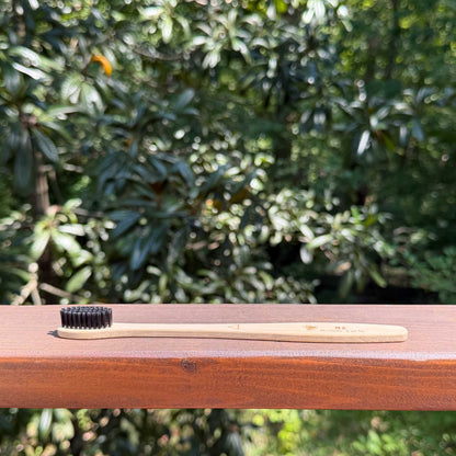 Bamboo charcoal toothbrush with castor oil bristles
