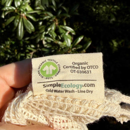 Close up of organic cotton mesh produce bag's label showing OTCO certification