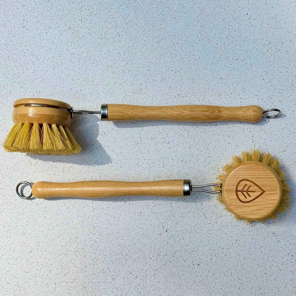 Side and top view of a sisal bamboo dish brush with wooden handle and metal hanging loop