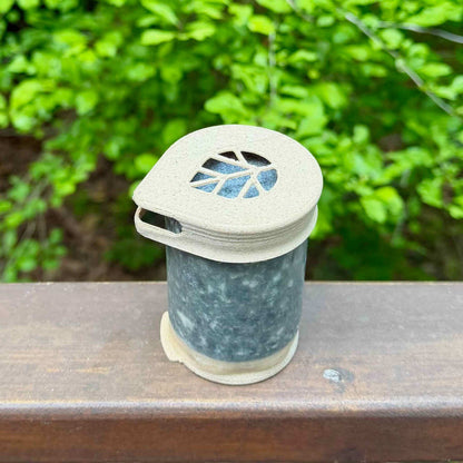 Stem shampoo bar in coconut hinoki scent with recyclable cap and coated in beeswax to prevent dissolving
